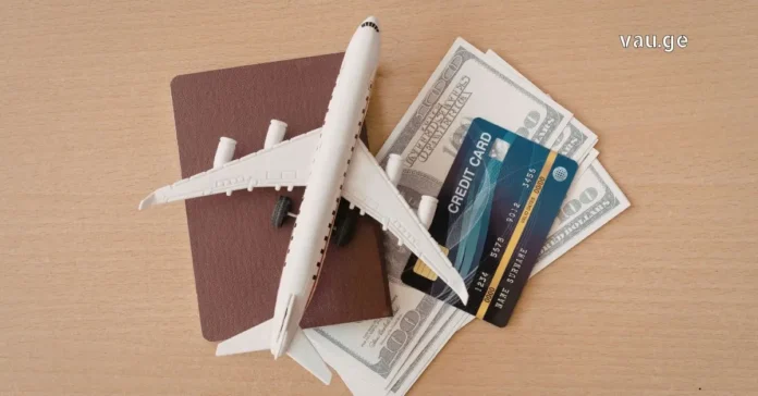 finding-the-perfect-tour-guide Travel planning essentials with laptop, airplane tickets, and world map on a wooden table