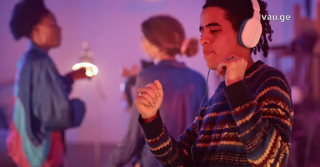 People dancing at a silent disco party in Georgia wearing wireless headphones