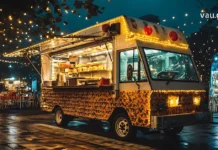 კულინარიული მოგზაურობა: ვინც სამყაროს გემოებით შეიმეცნებს A traveler enjoying local traditional dishes at an outdoor cafe with a map and passport on the table.