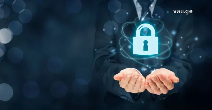 Cyber Security and Data Privacy Concept A businessman holding a glowing digital padlock icon representing cyber security and data protection.