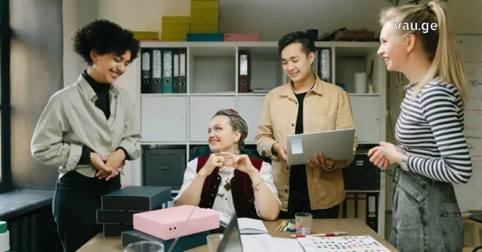 Gen Z Professionals Collaborating in Modern Office A diverse group of young Gen Z professionals collaborating and smiling in a modern office setting.